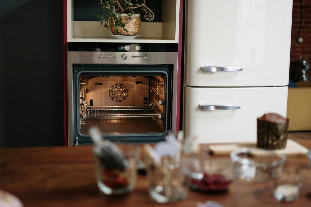 Ingredients on a kitchen counter in front of an open oven