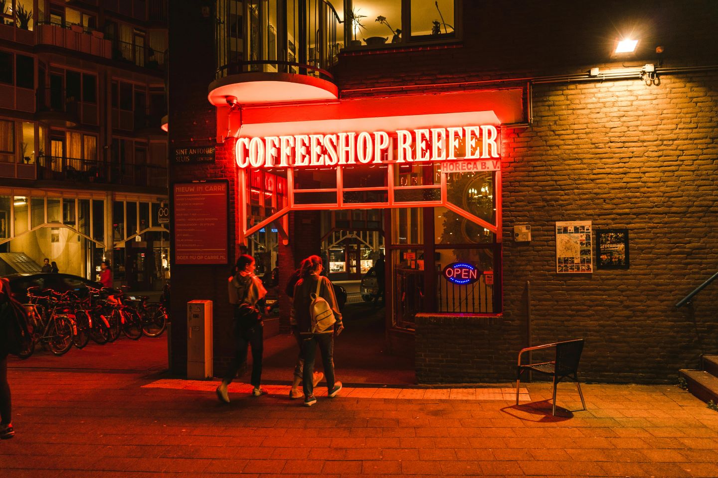 Amsterdam Coffeeshop store front  with two guests entering