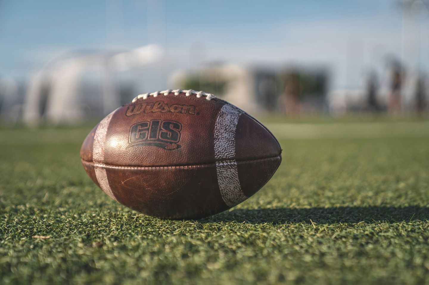 American football on grass field